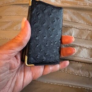 Textured Black leather Card Holder with Gold Corners holds numerous photos